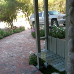 Stone Driveway with English Country style wood bench