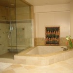 Sunken bathtub and glass shower enclosure
