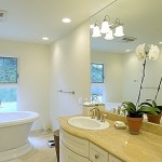 simple clean remodeled bathroom design with freestanding bath tub