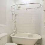 White bathroom with white and white tiled walls