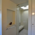 Glass enclosed shower and wall niche