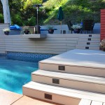 Grey Trex Deck with sitting area above the pool